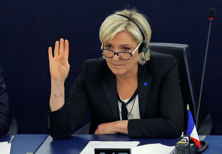 FILE PHOTO - Marine Le Pen, French National Front (FN) political party leader and Member of the European Parliament, takes part in a voting session at the European Parliament in Strasbourg, France, April 5, 2017. REUTERS/Vincent Kessler/File Photo