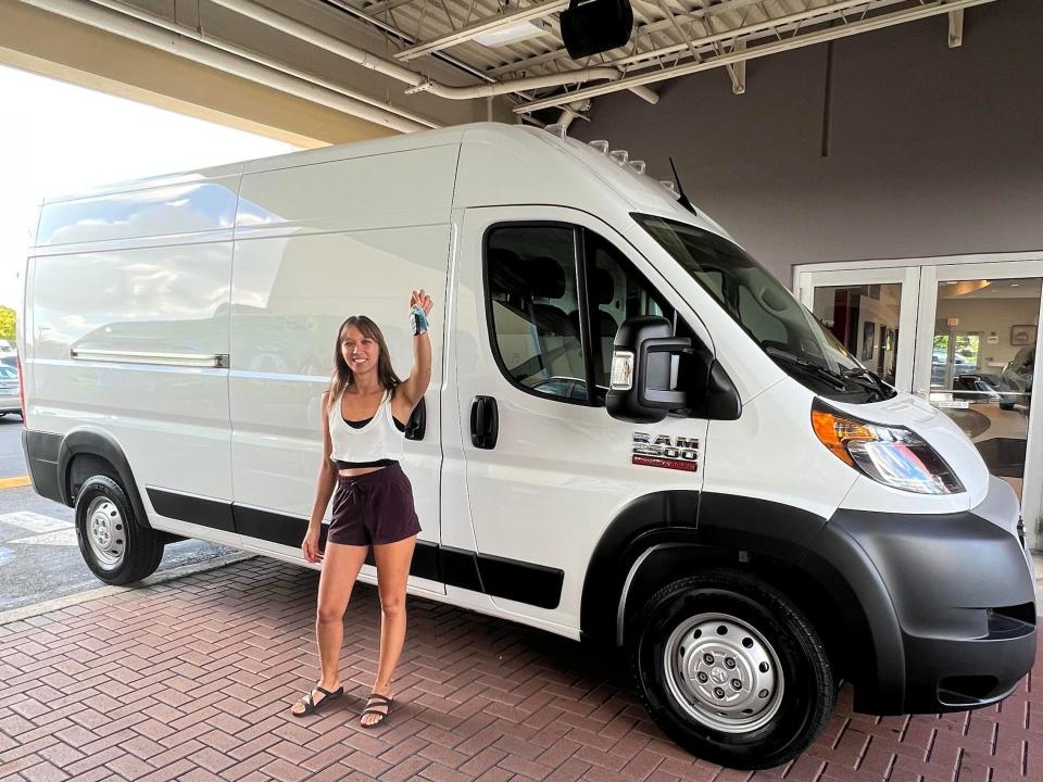 Nikita Crump in front of the new van that she will convert into a home.