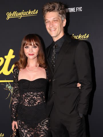 <p>David Livingston/Getty </p> Christina Ricci and Mark Hampton attend Showtimes's "Yellowjackets" FYC event in June 2022.