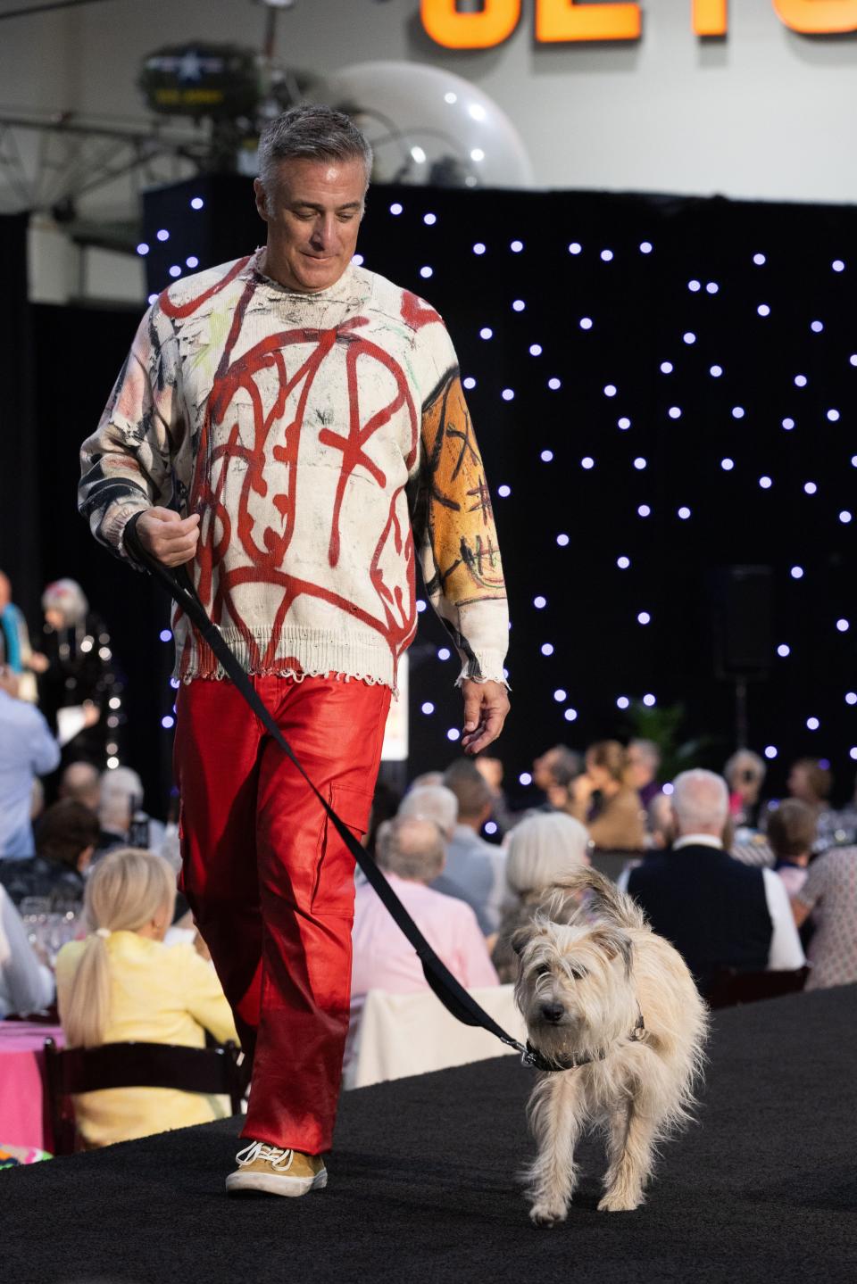 Gary Main and Lucy show off their moves at the 14th annual Men of the Desert fashion show benefiting Animal Samaritans on Dec. 3, 2023.