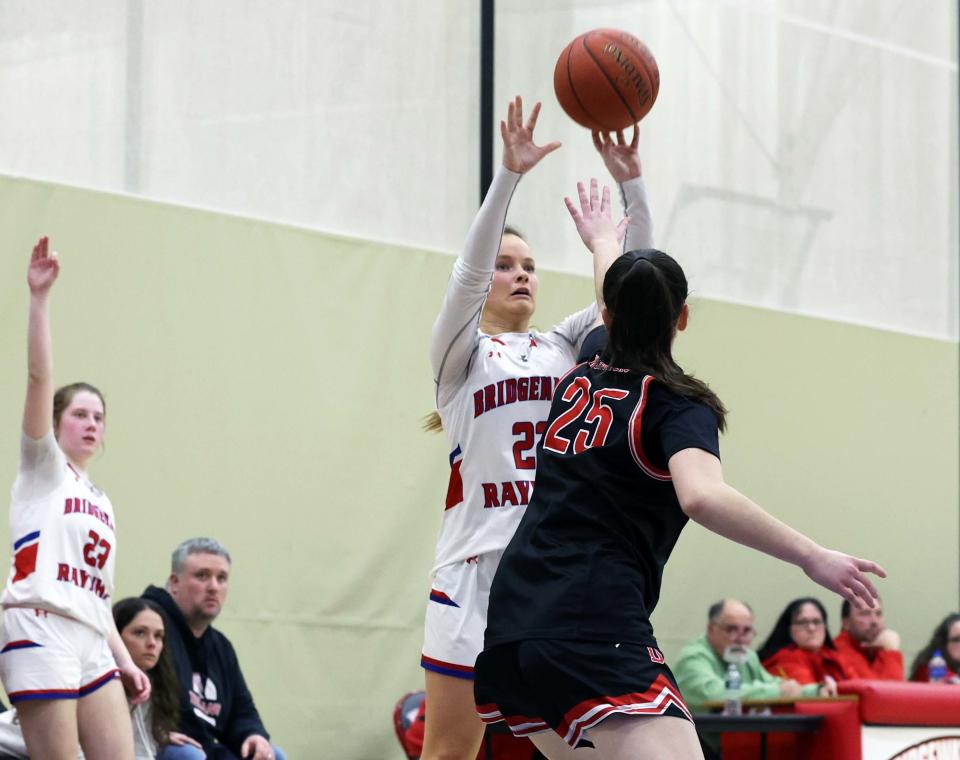 Bridgewater-Raynham's Emma Flaherty makes a three-point basket over a  Durfee defender during a game at Bridgewater State University on Friday, March 3, 2023.