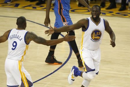 May 26, 2016; Oakland, CA, USA; Golden State Warriors forward Draymond Green (23) celebrates with guard Andre Iguodala (9) after scoring against the Oklahoma City Thunder in the second quarter in game five of the Western conference finals of the NBA Playoffs at Oracle Arena. Mandatory Credit: Cary Edmondson-USA TODAY Sports