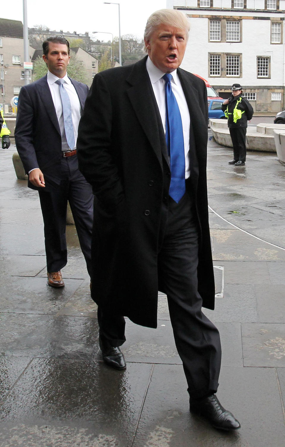 US business magnate Donald Trump and his son Donald Trump Jnr arrive at the Scottish Parliament in Edinburgh, Scotland, Wednesday April 25, 2012, where they will appear before the Scottish Parliament's Economy, Energy and Tourism Committee. Members of the committee are looking at how achievable the Scottish Government's green energy targets for 2020 are, with the meeting focusing on the impact the renewables industry could have on tourism and local communities. (AP Photo/PA, Andrew Milligan) UNITED KINGDOM OUT NO SALES NO ARCHIVE