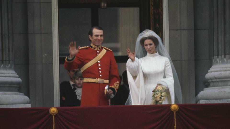 Captain Mark Phillips and Princess Anne wave from balcony