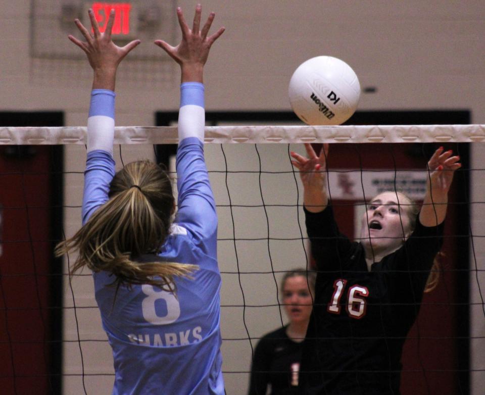 Bishop Kenny's Sofia Muino (16) hits the ball as Ponte Vedra's Railey Player (8) defends during high school volleyball.
