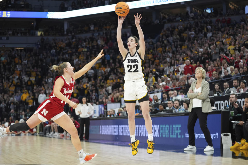 Iowa guard Caitlin Clark (22) shoots over Nebraska guard Callin Hake during overtime of an NCAA college basketball game in the final of the Big Ten women's tournament Sunday, March 10, 2024, in Minneapolis. (AP Photo/Abbie Parr)
