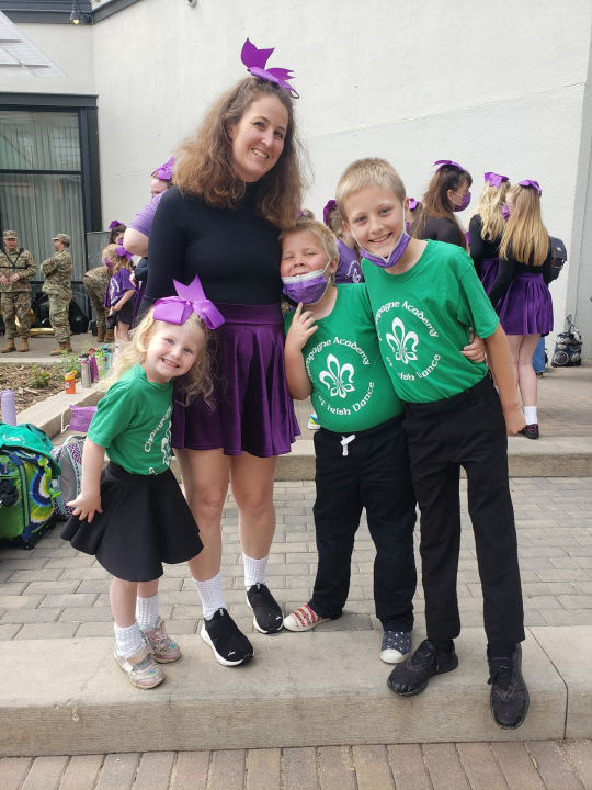 Stephanie and her kids at an Irish dance competition.