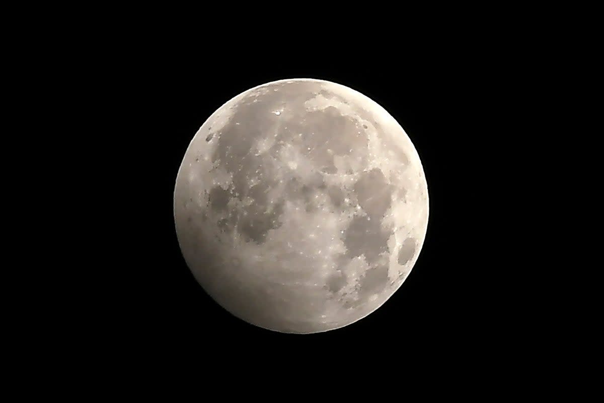 We see around 12 full moons a year when the sun is directly on the other side of the Earth from the moon (Prakesh Mathema / AFP via Getty Images)