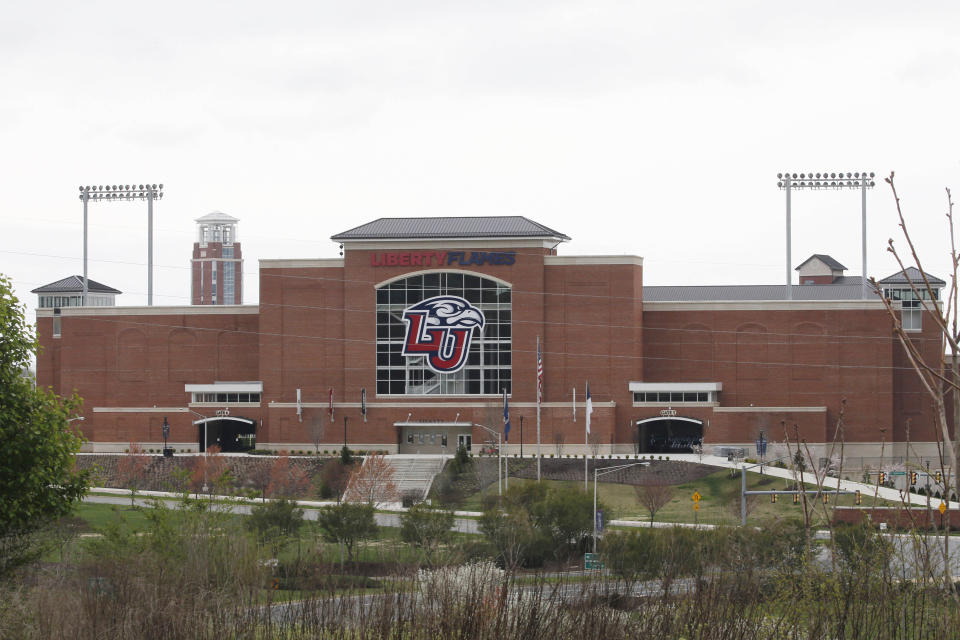 FILE - Liberty University's football stadium is empty as students were welcomed back to the university's campus, March 24, 2020, in Lynchburg, Va. Liberty University failed to warn its Virginia campus community about safety threats, including from individuals accused of sexual violence, according to a Washington Post report published on Tuesday, Oct. 3, 2023. (AP Photo/Steve Helber, File)