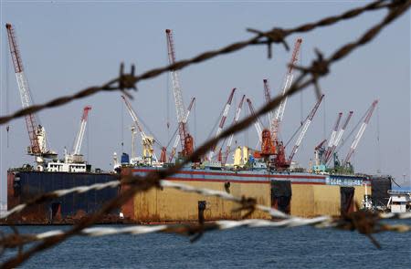 The dock of C.C shipyard Co.Ltd, which refurbished South Korean ferry Sewol in 2012 by adding space and weight to the vessel, is seen through a wire fence at a port in Yeongam April 22, 2014. REUTERS/Kim Kyung-Hoon