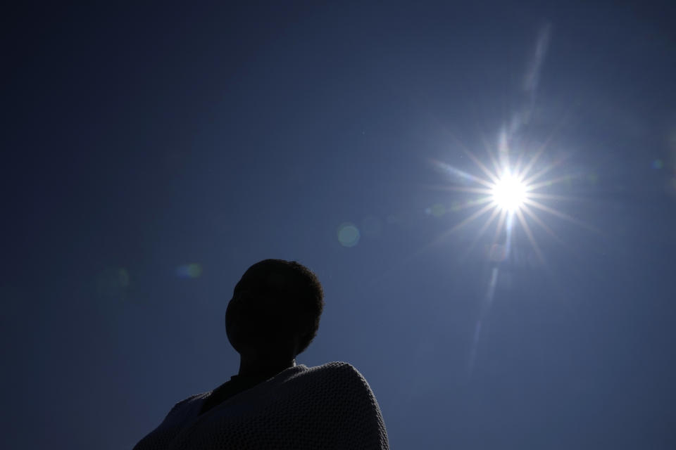 The mother of a student whose confidential sexual assault complaint was released online stands outside the Minneapolis Public Schools offices, Thursday, June 1, 2023, in Minneapolis. Ransomware gangs have been stealing confidential documents from schools and dumping them online. (AP Photo/Abbie Parr)