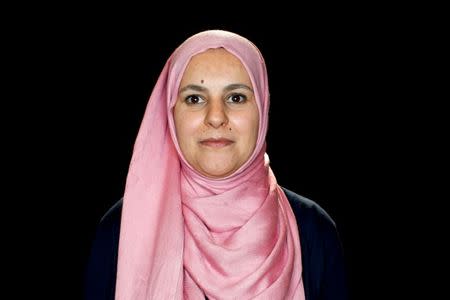 Yosra Boudhrioua from Tunisia poses for a portrait after her Canadian citizenship ceremony in Calgary, Alberta, Canada, May 29, 2017. Boudhrioua did not speak fluent English when she came to Canada in 2012. But five years later, when she attended the Calgary ceremony, she was completing a degree to become a teacher. "It doesn't put you down," she said of Canada's immigration system, which offers free language classes. "You're always up if you have the passion." REUTERS/Todd Korol