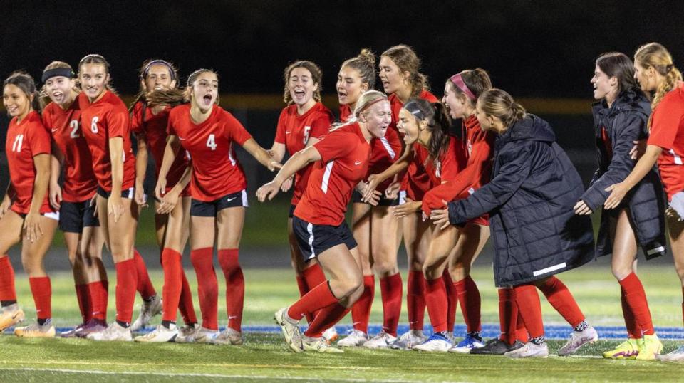 Boise’s Sammy Smith high-fives her teammates after scoring a penalty kick during the 5A District Three championship game. Smith was voted the 5A SIC Player of the Year by the league’s coaches.