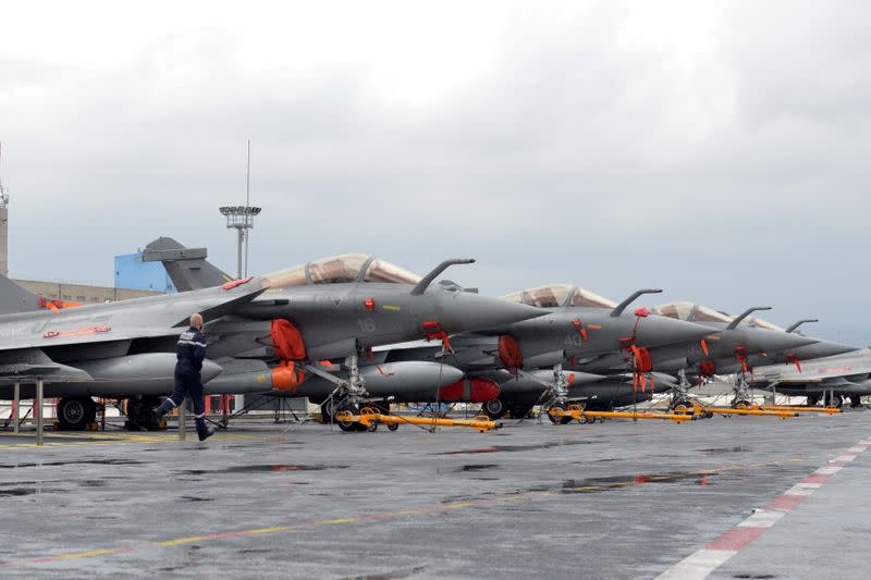 FILE PHOTO: French Navy Rafale fighter jets are seen onboard the Charles de Gaulle aircraft carrier, currently moored at the port of Limassol