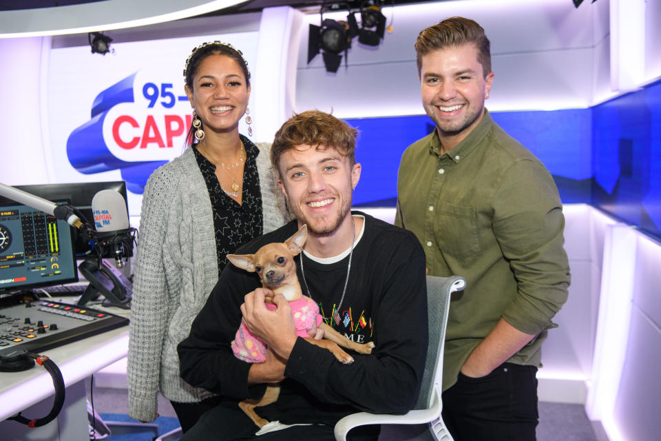 Roman Kemp pictured in the studio with Vick Hope and Sonny Jay, and pet dog Luna, on his first day back at Capital Breakfast, after coming third in 'I'm A Celebrity... Get Me Out Of Here!' (Photo by Matt Crossick/PA Images via Getty Images)