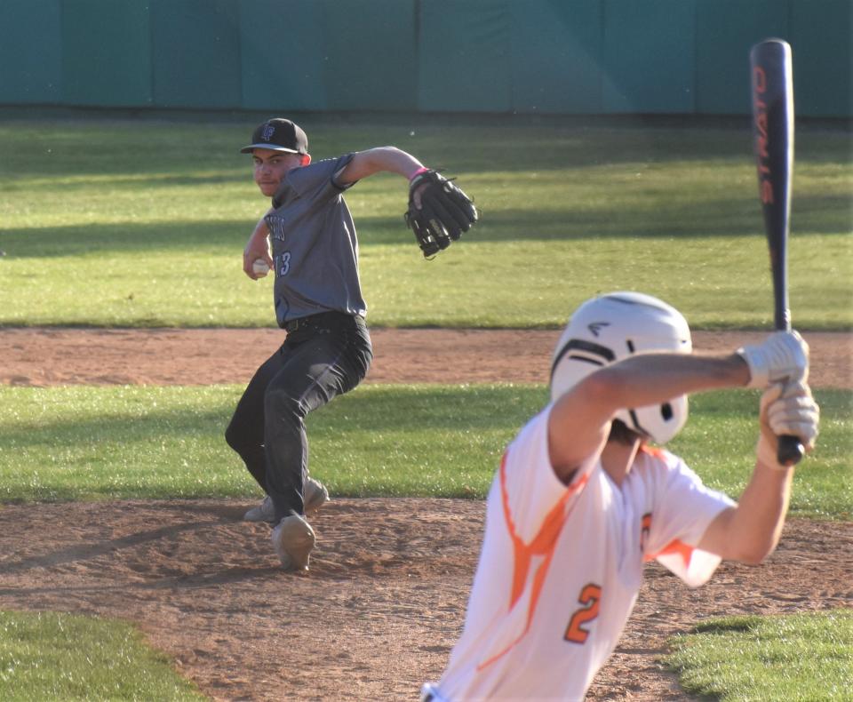 Little Falls Mountie Dreek Milianta delivers a pitch to Cooperstown Hawkeye Brenin Dempsey (2) Thursday at Doubleday Field in Cooperstown.