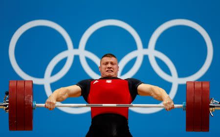 Poland's Tomasz Bernard Zielinski lifts on the men's 94Kg group B weightlifting competition at the ExCel venue at the London 2012 Olympic Games August 4, 2012. REUTERS/Dominic Ebenbichler