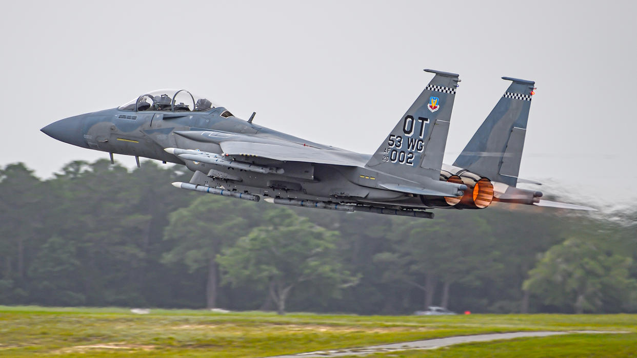A USAF F-15EX takes off carrying 12 AIM-120 AMRAAMs.