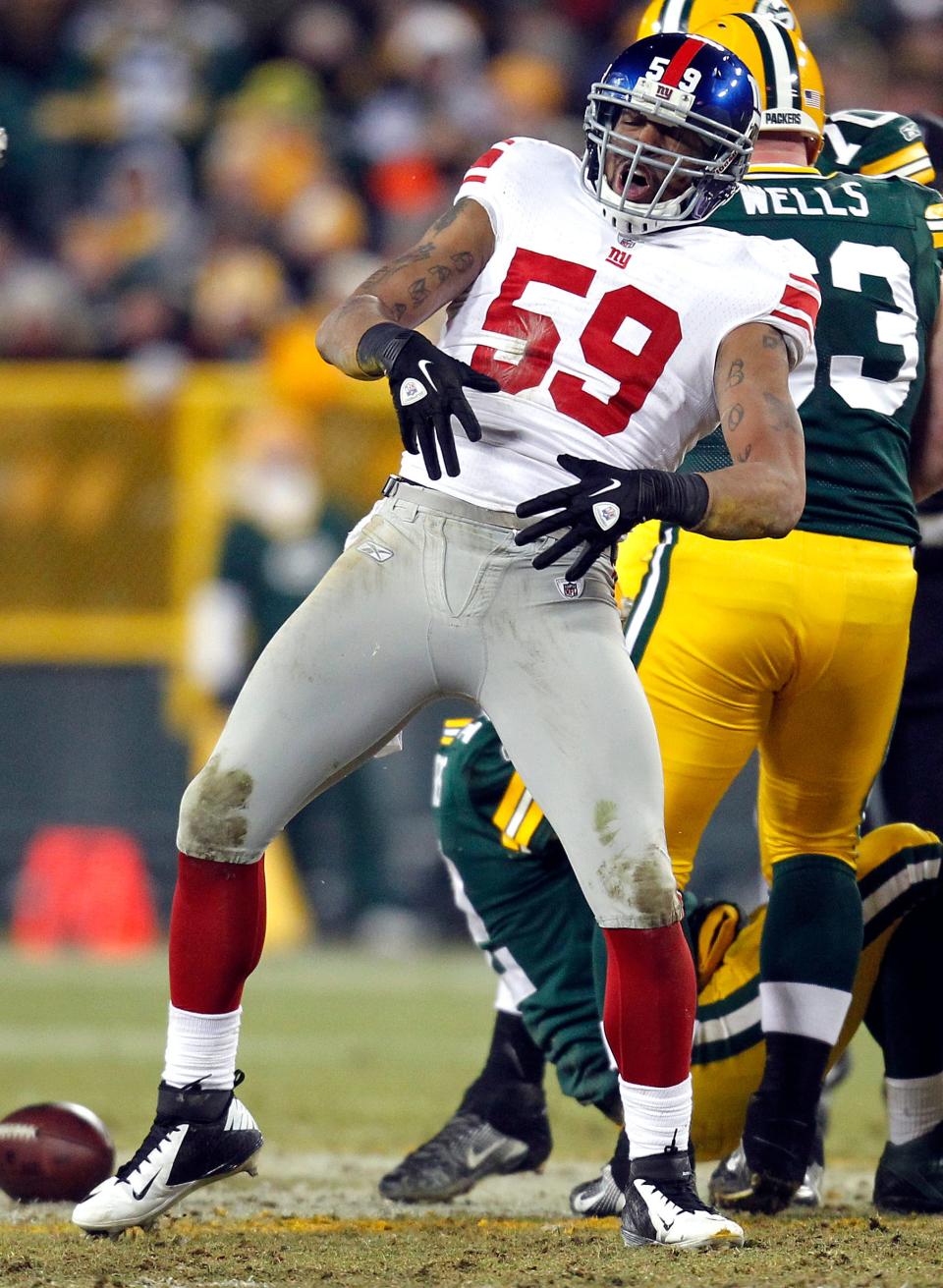 Michael Boley of the New York Giants does the championship belt move after he sacks Aaron Rodgers in the Green Bay Packers loss in a divisional playoff game Jan. 15, 2012. It's one of the rare instances where an opponent has mocked Aaron Rodgers' patented celebration and also won the game.