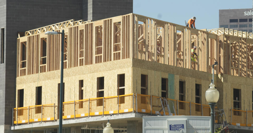 Workers toil on a high-rise building going up along Broadway north of downtown, Monday, July 24, 2023, in Denver. In the election, Tuesday, Nov. 7, voters will cast their ballots on Proposition HH, a measure aimed at the immediate property tax increases facing the state's landowners while lifting Colorado's revenue cap for the foreseeable future. (AP Photo/David Zalubowski)