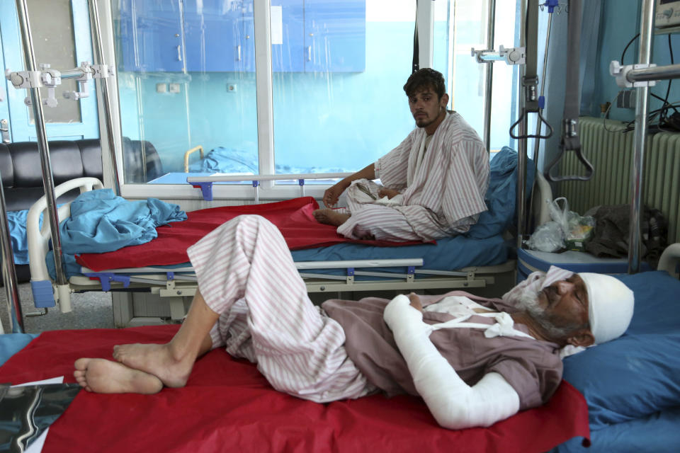 A wounded man receives treatment in a hospital after a bomb explosion during Friday prayer on the outskirts of Kabul, Afghanistan, Friday, May 24, 2019. According to Kabul police chief's spokesman, Basir Mujahid, the bomb was concealed in the microphone used to deliver the sermon. The prayer leader, Maulvi Samiullah Rayan, was the intended target, the spokesman added. (AP Photo/Rahmat Gul)