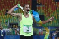 <p>Alexander Lesun of Russia celebrates as he crosses the finish line to win gold in the Modern Pentathlon on Day 15 of the Rio 2016 Olympic Games at Deodoro Stadium on August 20, 2016 in Rio de Janeiro, Brazil. (Photo by David Rogers/Getty Images) </p>