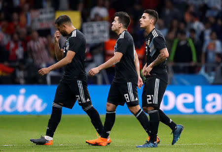 Soccer Football - International Friendly - Spain vs Argentina - Wanda Metropolitano, Madrid, Spain - March 27, 2018 Argentina's Gabriel Mercado, Marcos Acuna and Cristian Pavon looks dejected after the match REUTERS/Juan Medina