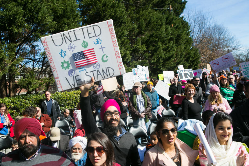 Japjee Singh of Dunwoody holds up a sign along with other activists during an Interfaith Rally for Muslims and Refugees at the Lutheran Church of the Redeemer on February 4, 2017 in Atlanta, Georgia.&nbsp;