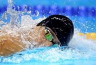 2016 Rio Olympics - Swimming - Men's 4 x 200m Freestyle Relay - Olympics Aquatics Stadium - Rio de Janeiro, Brazil - 09/08/2016. Michael Phelps (USA) of USA swims with an inverted Speedo cap borrowed from teammate Conor Dwyer after his own "MP" cap ripped. Picture taken August 9, 2016. REUTERS/Michael Dalder