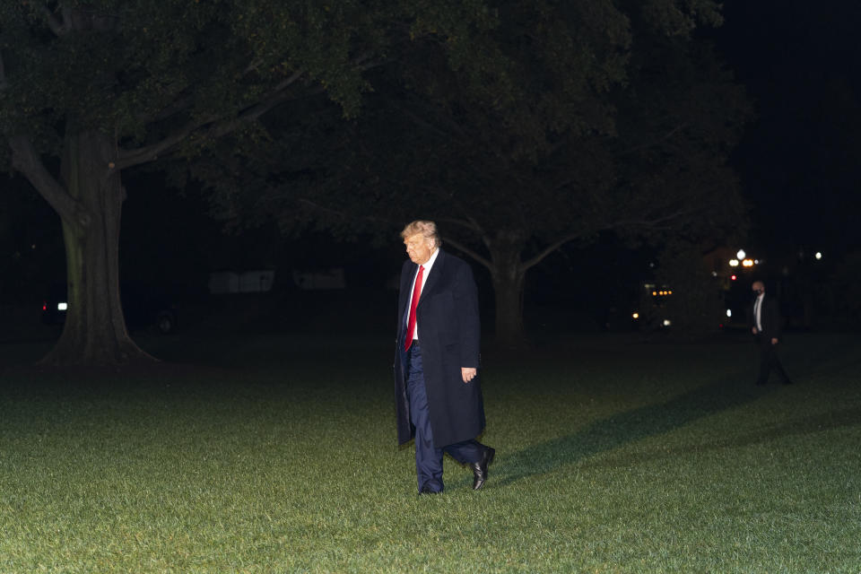 President Donald Trump walks on the South Lawn of the White House after stepping off Marine One, Wednesday, Oct. 21, 2020, in Washington. Trump is returning from North Carolina. (AP Photo/Alex Brandon)