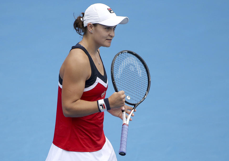 Ash Barty of Australia celebrates her win over Kiki Bertens of the Netherlands in their women's singles semifinal match at the Sydney International tennis tournament in Sydney, Friday, Jan. 11, 2019. (AP Photo/Rick Rycroft)