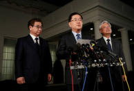 South Korea's National Security Office head Chung Eui-yong, center, and National Intelligence Service chief Suh Hoon, (L), make an announcement about North Korea and the Trump administration outside of the West Wing at the White House in Washington, U.S. March 8, 2018. REUTERS/Leah Millis