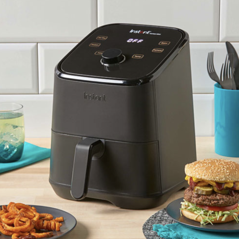 Instant Vortex Mini Air Fryer in black next to burger and fries (Photo via Best Buy Canada)