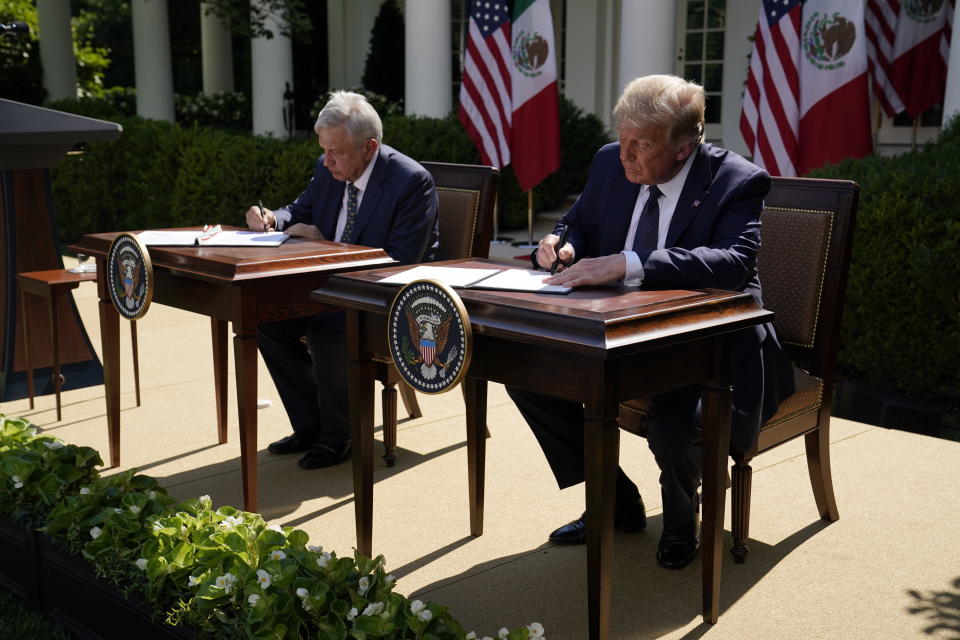 President Donald Trump and Mexican President Andres Manuel Lopez Obrador sign a joint declaration at the White House, Wednesday, July 8, 2020, in Washington. (AP Photo/Evan Vucci)