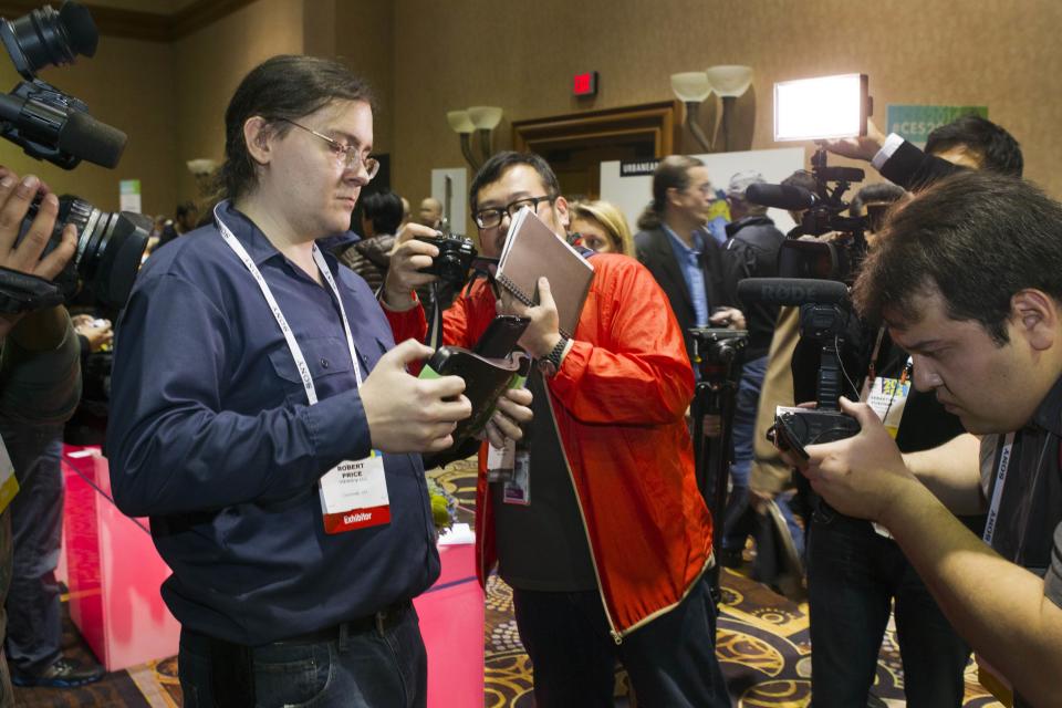 Robert Price demonstrates a TREWGrip keyboard is shown during "CES Unveiled," a media preview event to the annual Consumer Electronics Show (CES), in Las Vegas, Nevada, January 5, 2014. The keyboard keys face away from the user but allows people to type and enter data into a tablet while standing up. (REUTERS/Steve Marcus)