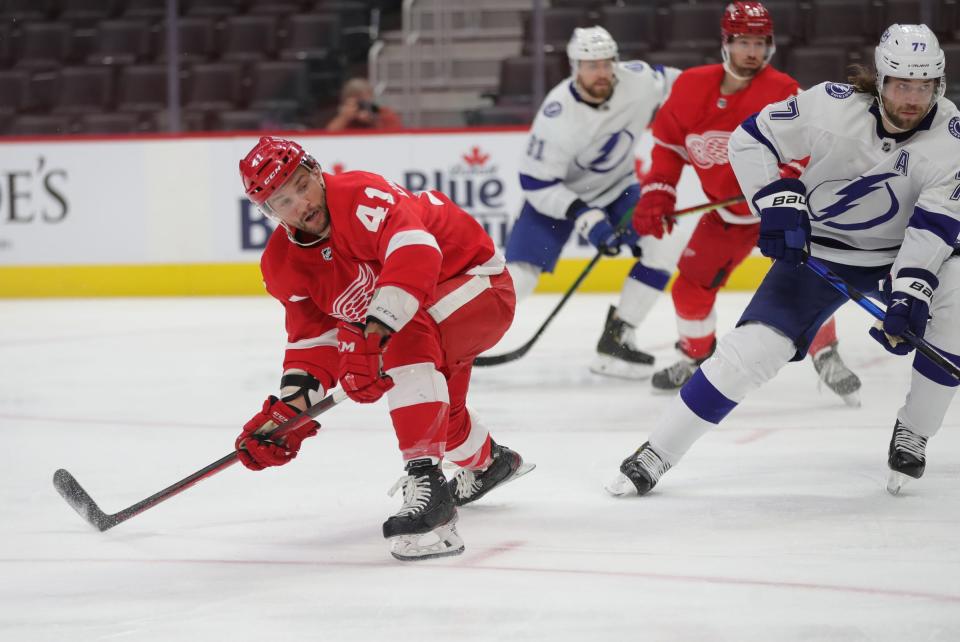 Red Wings center Luke Glendening goes after the puck against Lightning defenseman Victor Hedman during the first period on Sunday, May 2, 2021, at Little Caesars Arena.