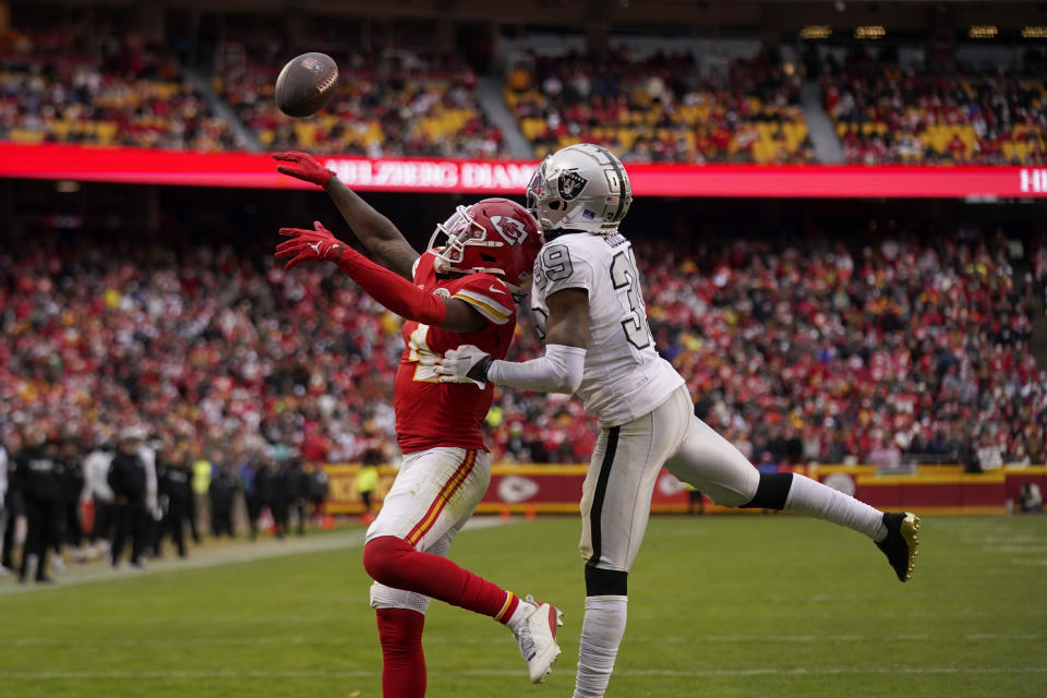 Las Vegas Raiders cornerback Nate Hobbs (39) breaks up a pass intended for Kansas City Chiefs wide receiver Rashee Rice (4) on fourth down during the second half of an NFL football game Monday, Dec. 25, 2023, in Kansas City, Mo. (AP Photo/Charlie Riedel)