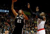 Dec 12, 2015; Atlanta, GA, USA; San Antonio Spurs center Tim Duncan (21) attempts a shot against Atlanta Hawks forward Paul Millsap (4) in the third quarter at Philips Arena. The Spurs defeated the Hawks 103-78. Mandatory Credit: Jason Getz-USA TODAY Sports