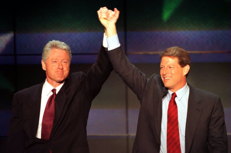 U.S. President Bill Clinton and Vice President Al Gore raise their hands in celebration after they accepted their party's nomination for re-election August 29, 1996, at the Democratic National Convention. Four years earlier, on July 9, 1992, Clinton named Gore his running mate. File Photo by Ray Foli/UPI