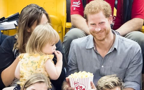 Harry shares his popcorn with Emily Henson.... after she helps herself - Credit: Danny Lawson/PA