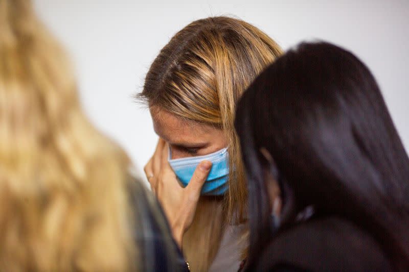 Israeli model Bar Refaeli wears a face mask amid the coronavirus disease (COVID-19) pandemic as she speaks to her lawyers inside a courtroom in Tel Aviv