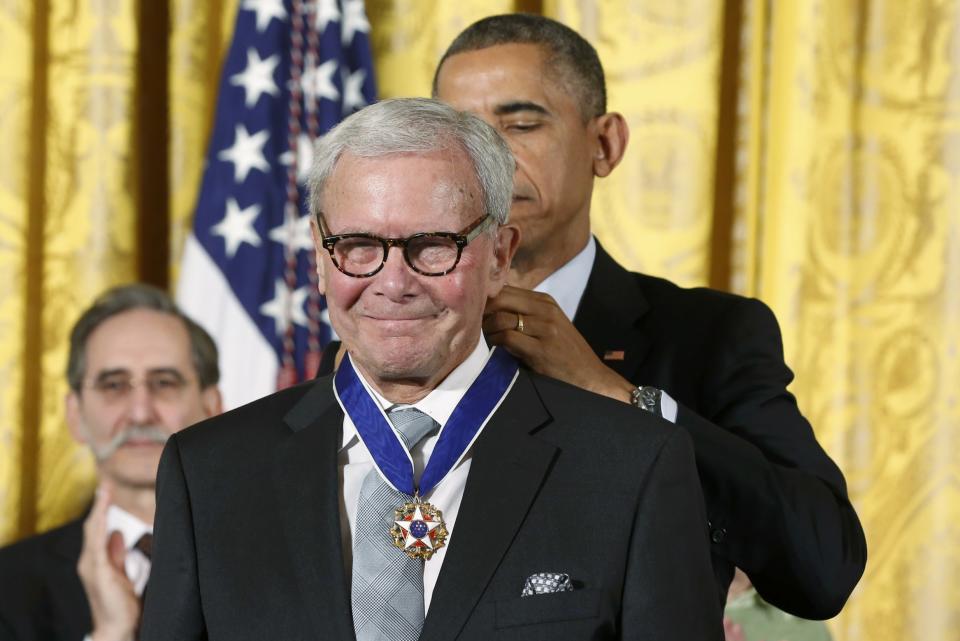 U.S. President Barack Obama (R) presents the Presidential Medal of Freedom to former NBC news anchorman Tom Brokaw during a White House ceremony in Washington, November 24, 2014. The Presidential Medal of Freedom is the Nation's highest civilian honor, presented to individuals who have made especially meritorious contributions to the security or national interests of the United States, to world peace, or to cultural or other significant public or private endeavors. (REUTERS/Larry Downing)