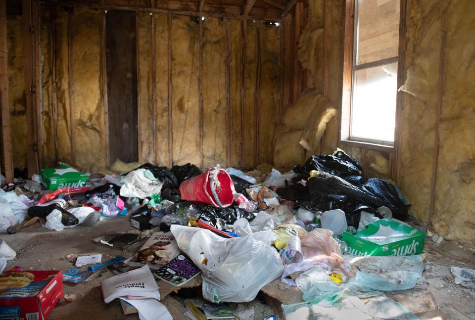 Resident Paul Buckney points out trash and one of several dilapidated structures at the Oakstead Mobile Home Park at 901 Massachusetts Ave. in Pensacola on Thursday, Oct. 19, 2023.