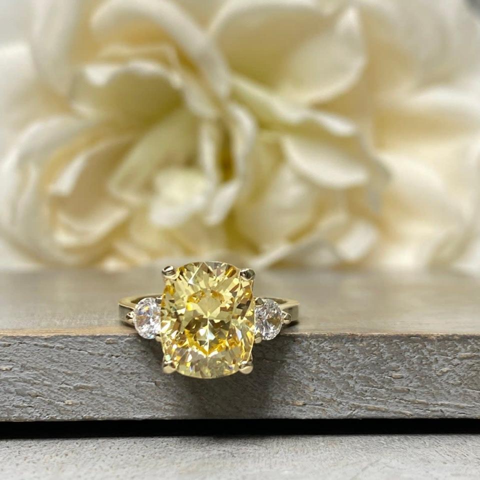 <p><span>Canary Yellow Elongated Cushion Engagement Ring</span> ($401)</p>