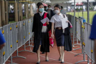 Students arrive for their graduation ceremony at the Thammasat University, Friday, Oct. 30, 2020, in Bangkok, Thailand. (AP Photo/Sakchai Lalit)