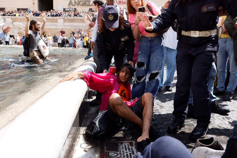 Climate activists protest at Trevi Fountain, Rome