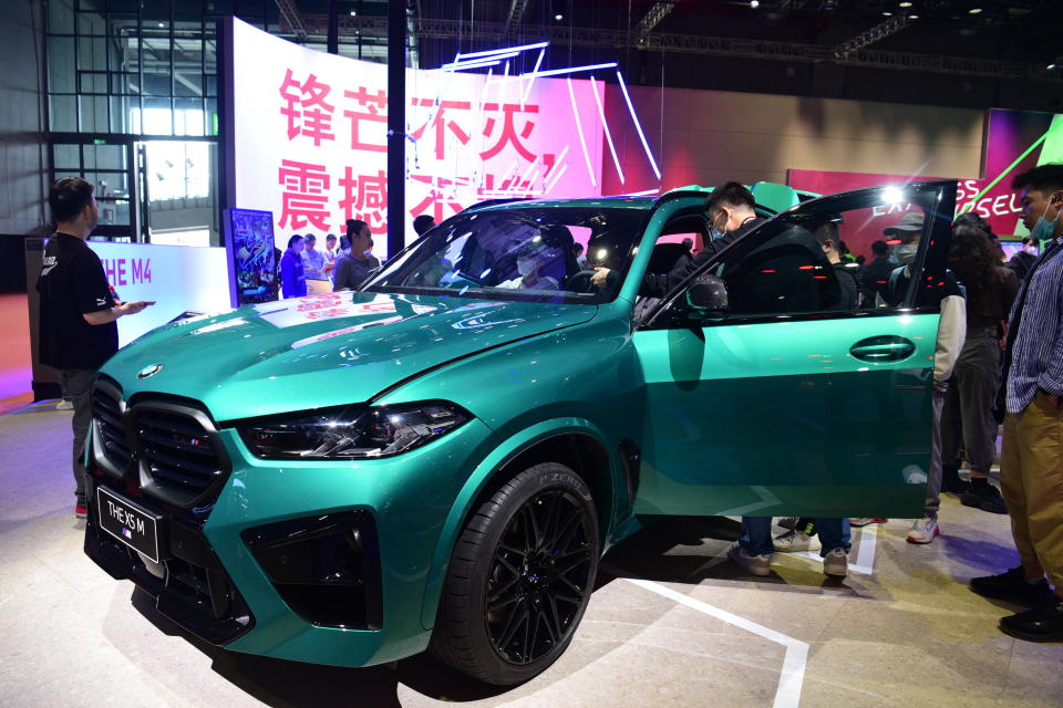 Visitors look at the BMW X5 at the 2023 Shanghai Auto Show in Shanghai, China, April 21, 2023. / Credit: CFOTO/Future Publishing via Getty Images