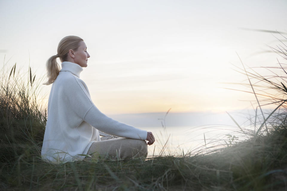 someone meditating outside