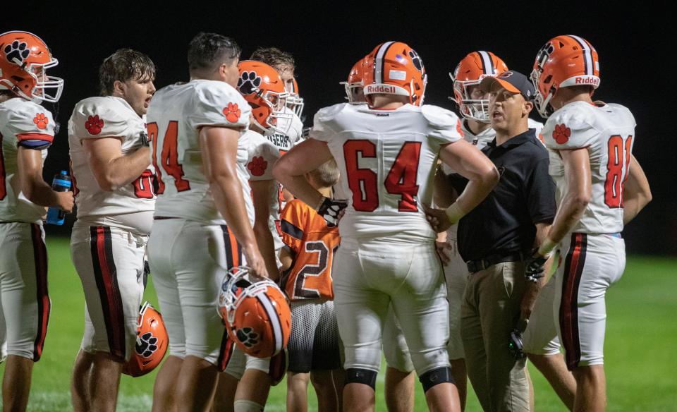 Byron's head coach Jeff Boyer talks to his team during a time out on Friday, Aug. 26, 2022, at Stillman Valley High School in Stillman Valley.