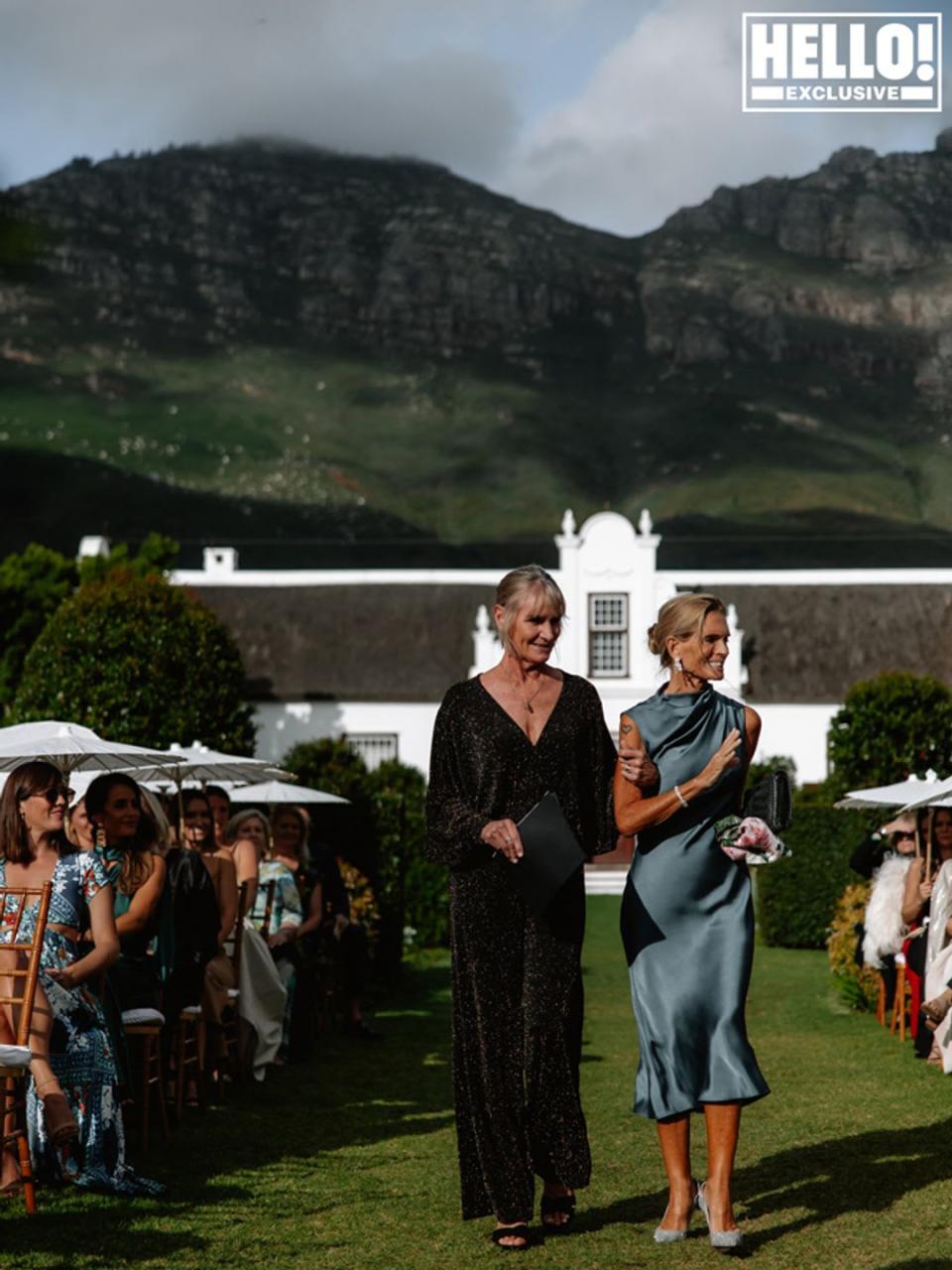 Victoria Lockwood in a blue dress walking down the aisle at Lady Amelia's wedding